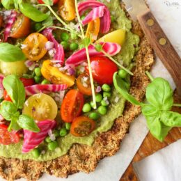 Cauliflower PIzza Crust, Pea Pesto & Salad Topping